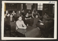 [recto] Joyce Hasegawa (second seat, first row) and June Iwata (first seat, second row) attend public school in Cleveland. Nine-year-old Joyce ...