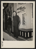 [recto] Los Angeles, Calif.--Tokutaro Slocum in front of the Japanese American Citizens League headquarters before evacuation of all residents of Japanese ancestry from this area. ;  Photographer: Albers, Clem ;  Los Angeles, California.