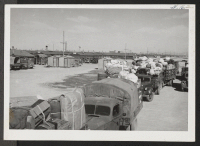 [recto] Convoy of checkable baggage heading for the Delta Station. ;  Topaz, Utah.