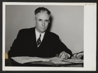 [recto] John H. Putz is the Relocation Officer for the State of Wisconsin with headquarters in Milwaukee. ;  Photographer: Mace, Charles E. ;  Milwaukee, Wisconsin.