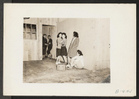 [recto] Arcadia, Calif.--Impromptu dancing at Santa Anita Park assembly centers for evacuees of Japanese ancestry. Evacuees are transferred later to War Relocation Authority centers for the duration. ;  Photographer: Albers, Clem ;  Arcadia, California.