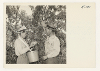 [recto] Ted Okimoto and one of his helpers, A. Kadoi, formerly from the Granada Center, who is now foreman at the Whitton Ranch and has been serving in that capacity for several months. He is now in charge of approximately 25 other Japanese workers. ;  Photogra