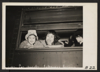 [recto] Los Angeles, Calif.--These little girls of Japanese ancestry are on the special train taking evacuees of Japanese descent from this area to an assembly center where they will await transfer to War Relocation Authority centers to spend the duration. ;  P