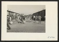 [recto] Evacuee High School students are here shown changing classes. ;  Photographer: Parker, Tom ;  McGehee, Arkansas.