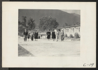 [recto] Arcadia, Calif.--Evacuees of Japanese ancestry out for a stroll at the Santa Anita Assembly Center. ;  Photographer: Albers, Clem ;  Arcadia, California.