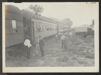 [recto] Train from Tule Lake as it arrived in Granada Wednesday, September 15, at 6 p.m. ;  Photographer: McClelland, Joe ;  Amache, Colorado.