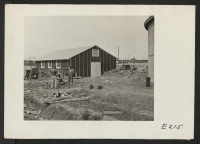 [recto] Evacuee workers are here constructing water facilities for use at the Jerome Relocation Center. ;  Photographer: Parker, Tom ;  Denson, Arkansas.