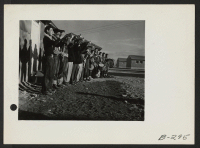 [recto] A Boy Scout band in full regalia greeted the evacuees from Hawaii when they arrived at this center. ;  Photographer: Stewart, Francis ;  Topaz, Utah.