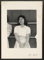 [recto] Sacramento, Calif.--This evacuee of Japanese ancestry is a graduate of the Fresno State College with a major in Education. She is one of several who have started a kindergarten school at this Center for over 300 of the younger evacuee children. ;  Photo