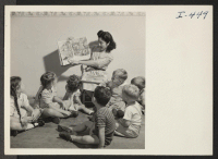 [recto] Miss Mildred Sasaki, formerly of Tule Lake Relocation Center is shown at her work in the Day Care Nursery and ...