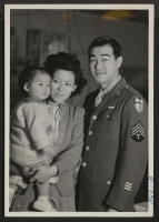 [recto] T/4 Taniguchi visits his wife and daughter at the Minidoka Relocation Center before returning to his unit in the Pacific. ...