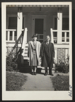 [recto] Standing at the front of their newly acquired duplex at 5210 Swope Parkway, Kansas City, Missouri, are Mr. and Mrs. ...