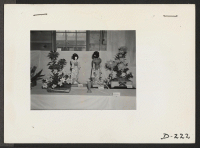 [recto] Floral arrangements in the recreation halls were part of the celebration which was held to commemorate Labor Day. ;  Photographer: Stewart, Francis ;  Newell, California.
