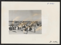 [recto] A panorama view showing the tremendous crowd which participated in the Labor Day celebration at this relocation center. Evacuee leaders as well as Caucasian administrators addressed the enthusiastic crowds. ;  Photographer: Stewart, Francis ;  Newell,