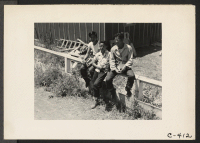 [recto] These boys of Japanese ancestry are among the several at this Assembly Center who are continuing their school studies voluntarily. ;  Photographer: Lange, Dorothea ;  Stockton, California.