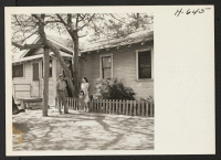 [recto] Hideo Satow, his wife Fumi and their daughter Barbara, the first returnees to Hawthorne (near Los Angeles), at their home ...