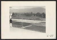 [recto] Arcadia, Calif.--An immense warehouse under construction at the Santa Anita Assembly Center for evacuees of Japanese ancestry who are temporarily being housed at this former race track. ;  Photographer: Albers, Clem ;  Arcadia, California.