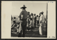 [recto] Manzanar, Calif.--Evacuees of Japanese ancestry are enjoying a baseball game at this War Relocation Authority center. This is a very ...