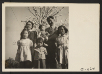 [recto] Henry Mitarai, age 36, successful large-scale farm operator with his family on their ranch about six weeks before evacuation. This family, along with other families of Japanese ancestry, will spend the duration at War Relocation Authority centers. ;  Ph
