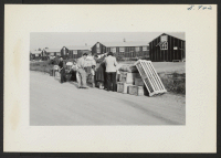 [recto] Receiving tags and check stubs for checkable baggages bound for Tule Lake. ;  Photographer: Lynn, Charles R. ;  Dermott, Arkansas.