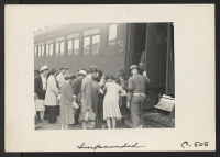 [recto] The train is about to depart which will take these evacuees of Japanese ancestry from this rich agricultural district to the Merced Assembly Center, about 125 miles away. Many leave close friends behind. ;  Photographer: Lange, Dorothea ;  Woodland, C