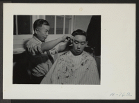 [recto] Barber shop. J. K. Kimura, Head barber. Ted Arai. ;  Photographer: Stewart, Francis ;  Hunt, Idaho.