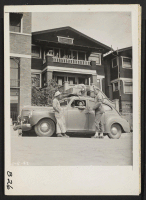 [recto] San Pedro, Calif.--Military police give advice to evacuees of Japanese ancestry as the last leave their Redondo Beach homes for assembly center at Arcadia, California. Evacuees will be transferred later to War Relocation Authority centers for the duration