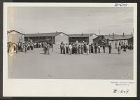 [recto] Evacuees staging a Boy Scout Memorial Day Service on May 30. ;  Photographer: McClelland, Joe ;  Amache, Colorado.