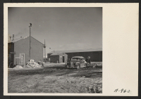 [recto] Exterior views of the motor pool and gas station. This motor pool is used as a checking station for all vehicles used on the project. ;  Photographer: Stewart, Francis ;  Newell, California.