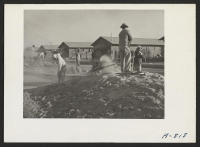 [recto] School buildings. These school buildings are being erected by evacuee laborers. The structures will be of adobe which is made in the local evacuee operated adobe factory. ;  Photographer: Stewart, Francis ;  Poston, Arizona.