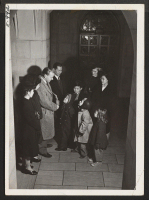 [recto] Yasamura family. In the foyer of the famed Riverside Church in New York, the Yasamura family stop to chat with ...