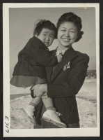 [recto] Alice Chira and daughter Sachi, 28 months old. The husband and father Sam Chira was a farmer before evacuation in El Monte, California. He specialized in the raising of fine strawberries. ;  Photographer: Parker, Tom ;  Heart Mountain, Wyoming.
