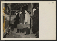 [recto] Selectees from Heart Mountain Relocation Center departing from the Powell Draft Board for pre-induction physical to be given at Fort Warren, Wyoming. ;  Photographer: Iwasaki, Hikaru ;  Powell, Wyoming.