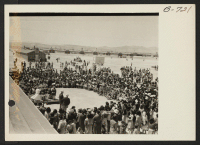 [recto] Scene at Topaz. Crowds entertained by Delta High School Band. ;  Photographer: Bankson, Russell A. ;  Topaz, Utah.