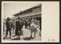[recto] San Bruno, Calif.--Families of Japanese ancestry arrive at assembly center at Tanforan Race Track. Evacuees will be transferred later to War Relocation Authority centers where they will be housed for the duration. ;  Photographer: Lange, Dorothea ;  S