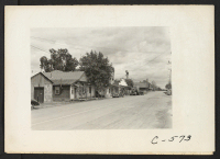 [recto] Florin, Calif.--Main street of this small town in the center of the strawberry and grape-producing area. Most of the population ...