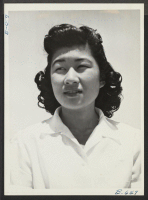 [recto] Miss Marion Konishi, who made the commencement speech at the Granada Relocation Center High School. ;  Photographer: McClelland, Joe ;  Amache, Colorado.