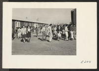 [recto] Evacuee High School students are here shown changing classes. ;  Photographer: Parker, Tom ;  McGehee, Arkansas.
