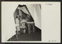 [recto] Manzanar, Calif.--Making an examination of an evacuee patient are Dr. Takahashi, Ear, Nose and Throat Specialist, and his wife, who serves as his assistant. They are evacuees of Japanese ancestry from Los Angeles now at this War Relocation Authority Cente