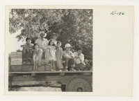 [recto] Butte Co-Operative Farms, Gridley, California. This group was engaged in distributing boxes to the orchards where they have been employed ...