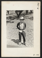 [recto] One of 7 children in the Hamachi family pictured on the Hamachi farm in Alameda County the day before he was evacuated. Evacuees of Japanese ancestry will be housed in War Relocation Authority centers for the duration. ;  Photographer: Lange, Dorothea