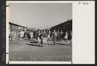 [recto] A group of evacuee High School students are here shown changing classes. ;  Photographer: Parker, Tom ;  McGehee, Arkansas.