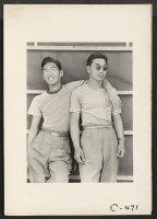 [recto] Sacramento, Calif.--College students of Japanese ancestry who have been evacuated from Sacramento to the Assembly Center. ;  Photographer: Lange, Dorothea ;  Sacramento, California.