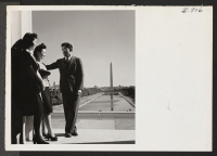 [recto] Jane Oi from Granada Relocation Center, Sally Fujimoto, from Manzanar, and Harrio Najima from Tule Lake, visit the Lincoln Memorial. All three are working for the War Relocation Authority in Washington. ;  Photographer: Van Tassel, Gretchen ;  Washin