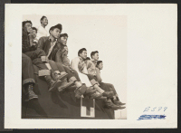 [recto] A tense moment in a football game between Stockton and Santa Anita teams finds spectators perched everywhere. ;  Photographer: Parker, Tom ;  McGehee, Arkansas.