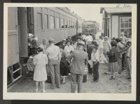 [recto] Tule Lake-bound evacuees from Granada are shown at the Granada depot. ;  Photographer: McClelland, Joe ;  Amache, Colorado.