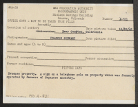 [verso] Evacuee property. A sign on a telephone pole on property which was formerly operated by farmers of Japanese ancestry. ;  Photographer: Stewart, Francis ;  Compton, California.