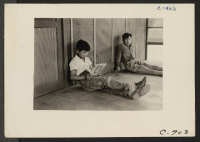 [recto] Manzanar, Calif.--Orphan boys, two of a group of 65 who are now making their home in the Children's Village at this War Relocation Authority center for evacuees of Japanese ancestry. ;  Photographer: Lange, Dorothea ;  Manzanar, California.