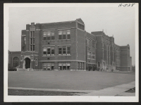 [recto] Blaine Seminary grade school is just two blocks from the Yamada home, and is attended by Dexter Yamada, 5-year-old son of Mr. and Mrs. Kelly Yamada. ;  Photographer: Mace, Charles E. ;  Peoria, Illinois.