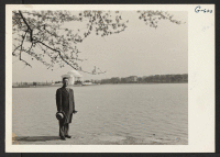 [recto] Rev. Thomas Machida visits the Tidal Basin in Washington. The Jefferson Memorial is seen in the background. Rev. Machida is working for the Federal Communication Commission and, like several other evacuees in Washington, is living in one of the government